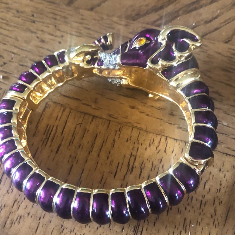 Gold tone and purple elephant bracelet.